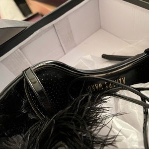 Black feathered heels